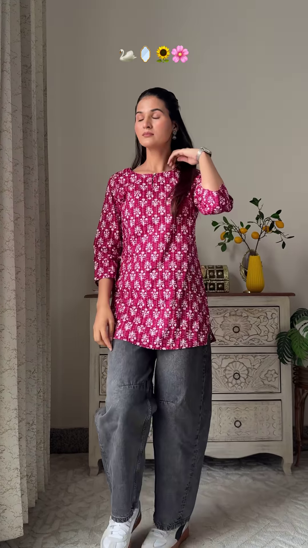 Women’s Sleeveless Red Floral Top with Light Blue Flared Jeans – Indo-Western Casualwear Styled with Vintage Decor Backdrop - Image 3